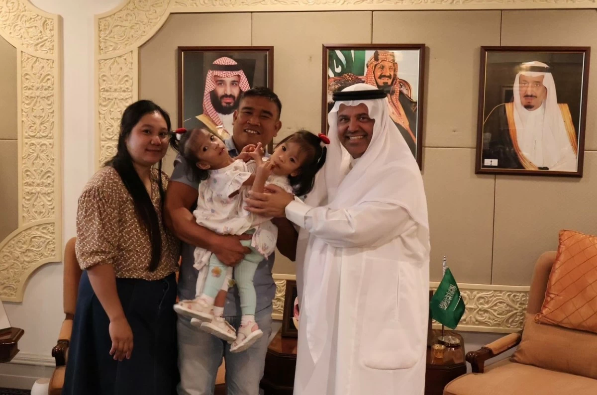 H.E. Faisal Ebraheem Alghamdi, Ambassador of the Custodian of the Two Holy Mosques to the Republic of the Philippines, shares a meaningful moment with Filipino conjoined twins Olivia and Gianna Manuel and their parents