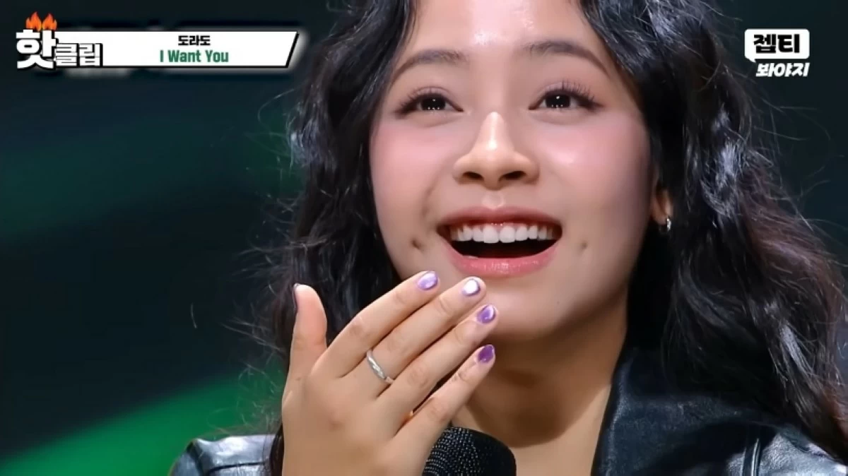 Filipino singer Gwyn Dorado reacts after getting high scores from the judges on the Korean TV show 