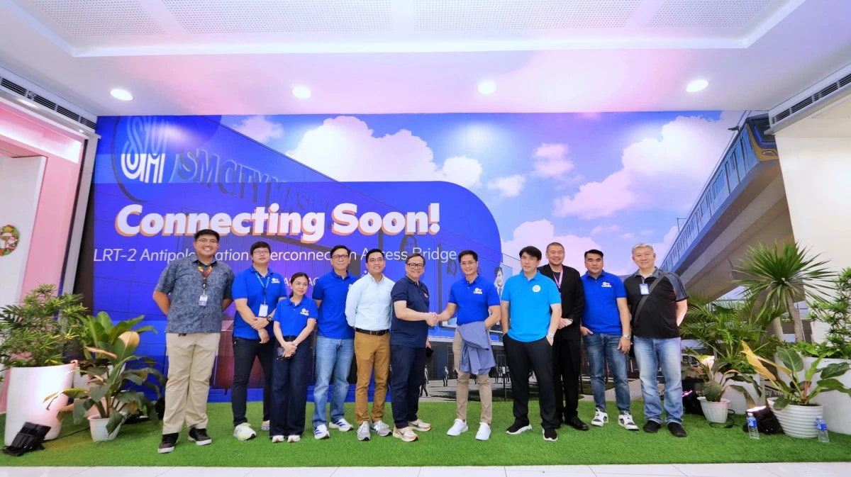 SM Executives and LRTA Officials pose for commemorative photo at the soon-to-open interconnection access bridge at SM City Masinag.