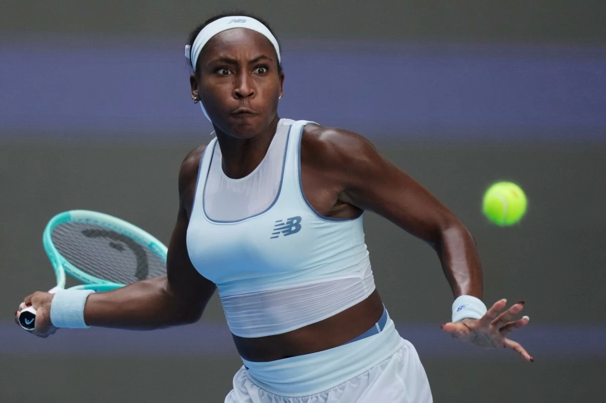 FILE - Coco Gauff of the United States plays a forehand to Belinda Bencic of Switzerland during a women's singles match of the China Open tennis tournament, in Beijing, on Sept. 30, 2025. (AP Photo/Mahesh Kumar A., File)