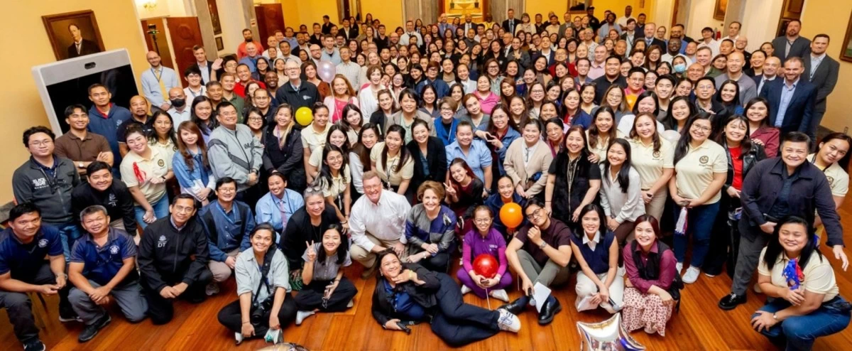 The official US Embassy family: Ambassador MaryKay Carlson joined by her spouse, Aubrey Alexander Carlson, with embassy staff and Filipino partners, reflecting on years of service and shared accomplishments.