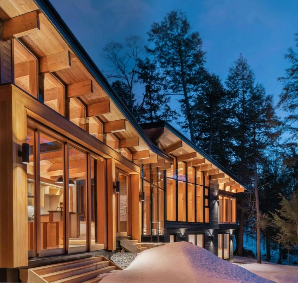 Barlochan Cottage in Muskoka Lakes, Ontario is a four-season retreat by Trevor McIvor Architect Inc. clad in charred Kindl wood and anchored by a central granite fireplace. (Photos from Trevor McIvor Architect Inc. website)