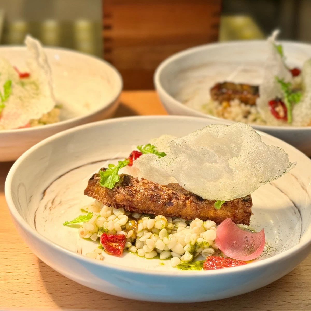 Tofu Inasal on Adlai served on tasting plate, available at the Plant-Based Buffet Station