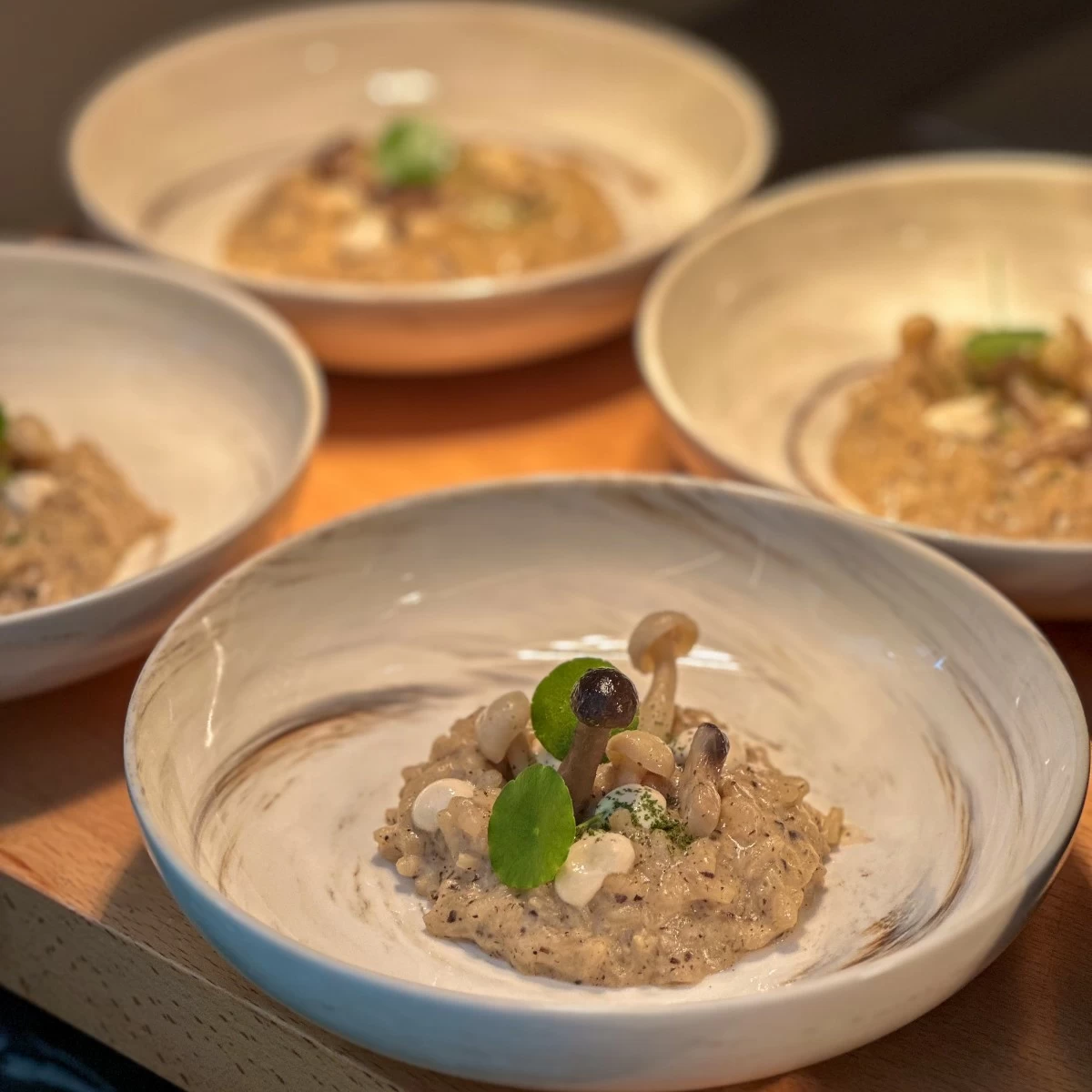 Mushroom Truffle Risotto served on tasting plate, available at the Plant-Based Buffet Station