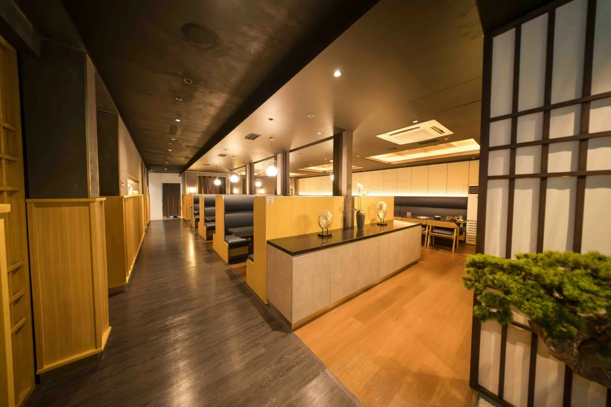 QUIET LUXE The serene, wood-and-stone interiors of Hiro Premier at SM Aura set the tone for a yakiniku experience defined by restraint, precision, and calm.