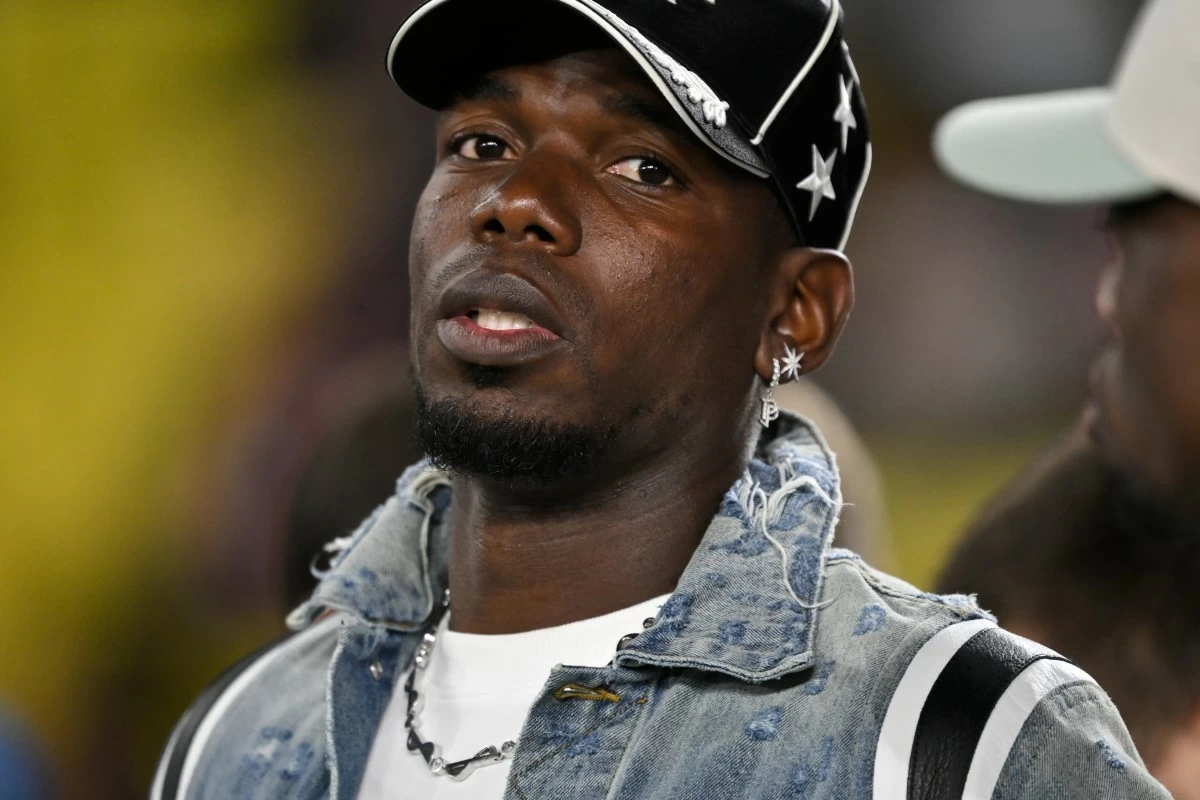 FILE - Monaco's Paul Pogba stands on the touchline as players warm-up before a Champions League opening phase soccer match between Monaco and Tottenham Hotspur in Monaco, Wednesday, Oct. 22, 2025. (AP Photo/Philippe Magoni, file)