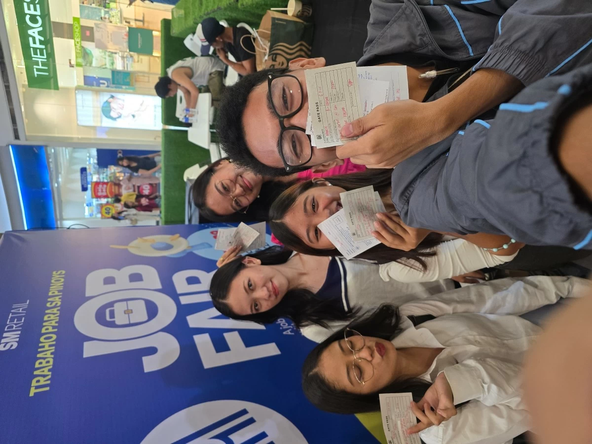 Job seekers excitedly flex their call back interview slips during an SM Job Fair conducted in 2025.