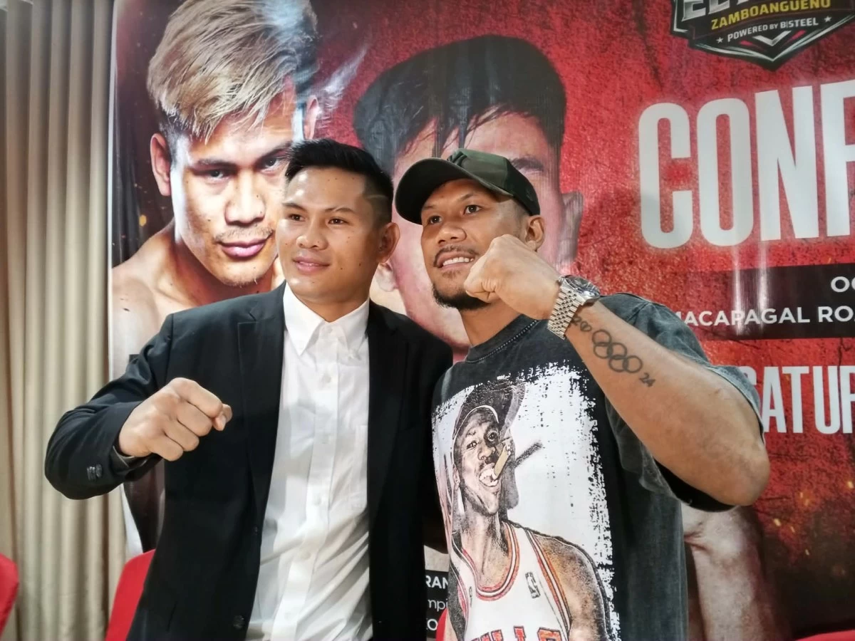 Weljon Mindoro, left, gets into a morale-boosting fight in the event which is led by his fellow Zamboangueño pug Eumir Marcial.
