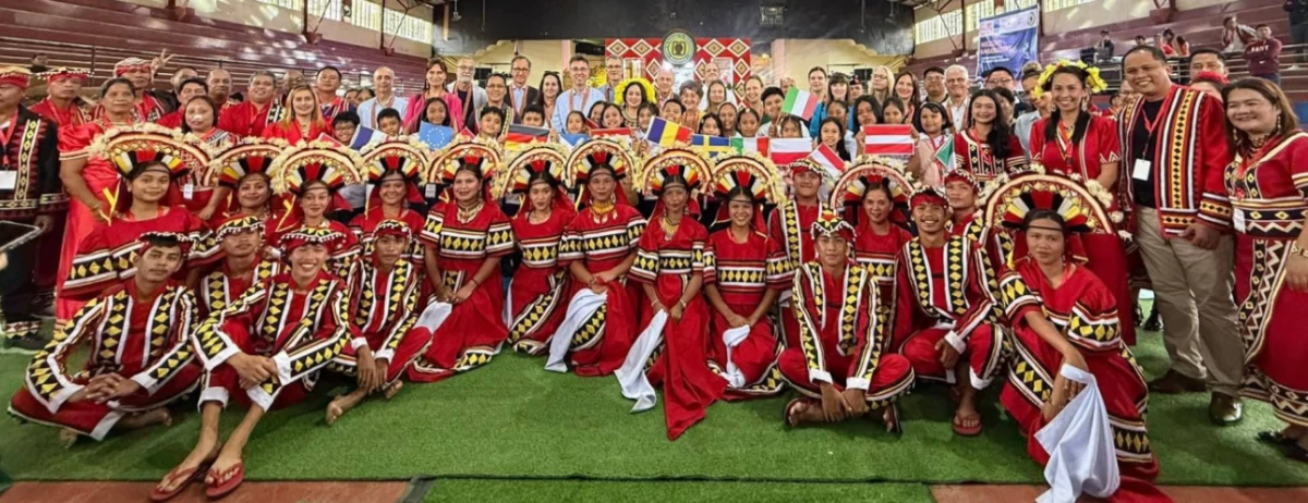 European Union ambassadors join the performers for a group photo
