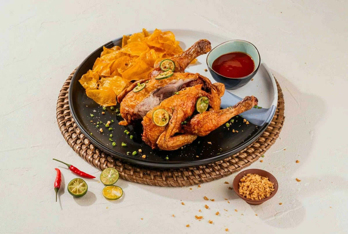 CRISP COMFORT Pinatisang Fried Chicken, golden and crunchy, delivering familiar Filipino flavors with a satisfying bite.