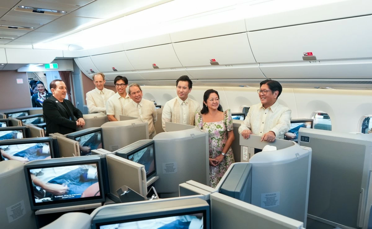 President Ferdinand Marcos Jr. and First Lady Louise Araneta-Marcos, guided by PAL Holdings Inc. President Lucio Tan III and airline executives, inspect the interior of the new Airbus A350-1000.