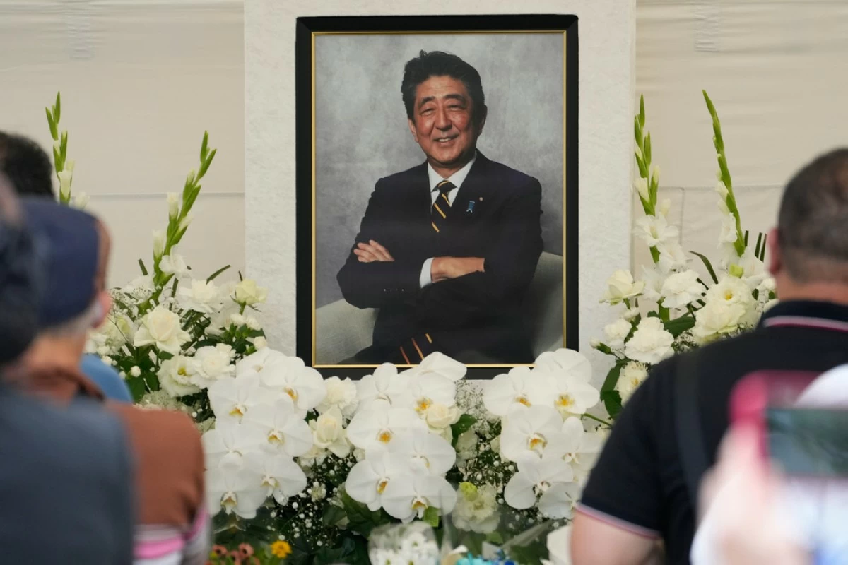 FILE - People offer prayers for former Prime Minister Shinzo Abe at Zojoji temple in Tokyo, Japan, July 8, 2023. (AP Photo/Shuji Kajiyama, File)