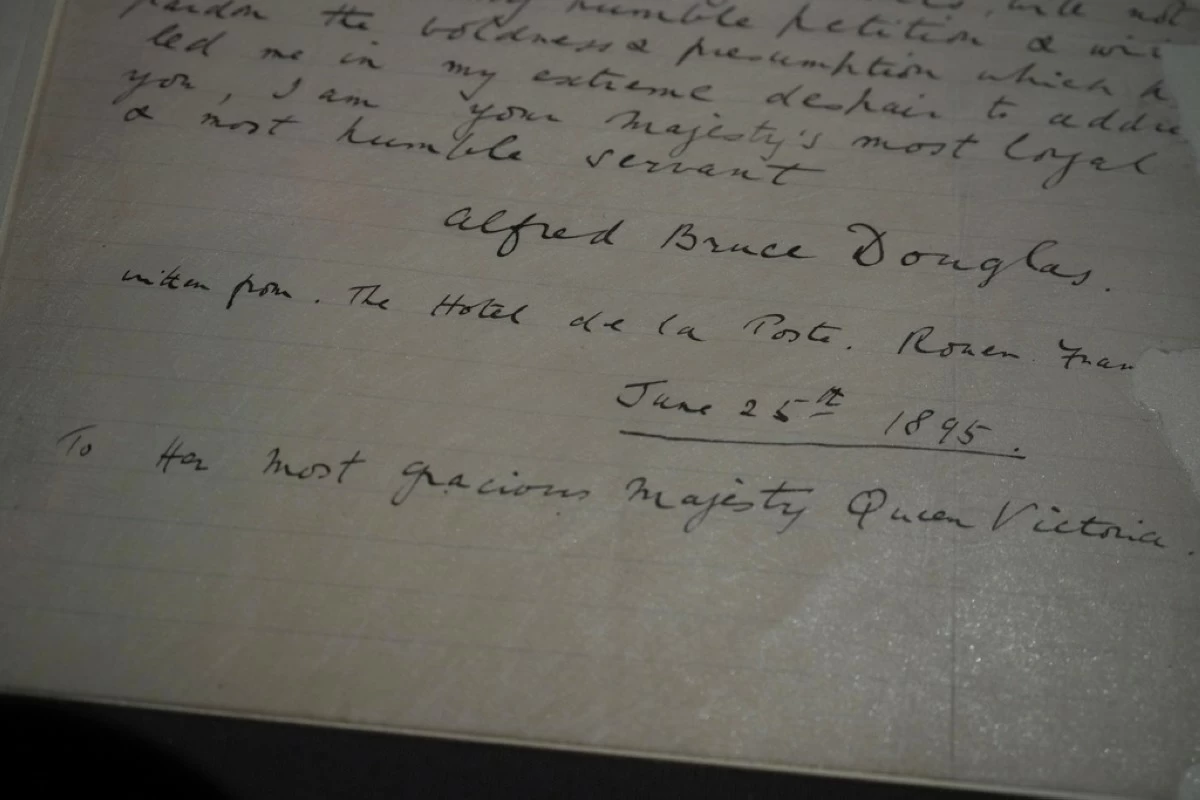 A letter written by Lord Alfred Douglas to Britain's Queen Victoria, petitioning for the release of Oscar Wilde from prison on display during a press preview of an exhibition entitled Love Letters at the National Archives in London, Wednesday, Jan. 21, 2026, Wilde was imprisoned in 1895 for gross indecency. (AP Photo/Alastair Grant)