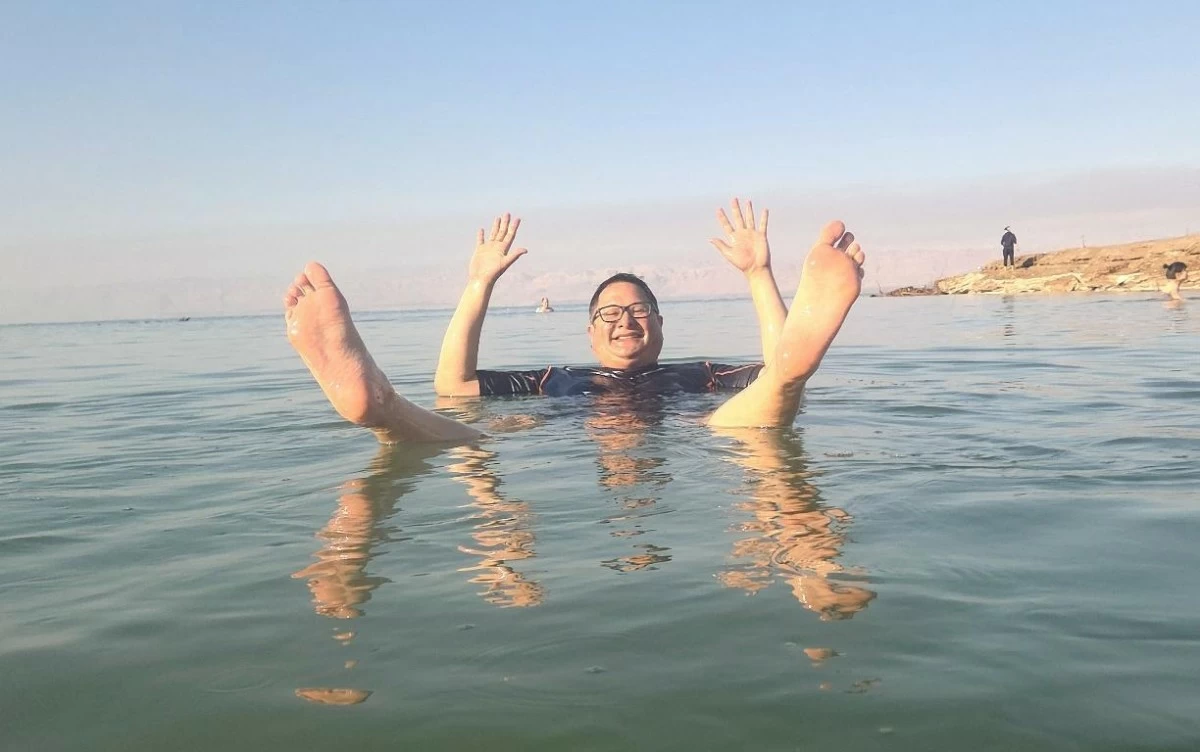 LIGHT AS A FEATHER The author floating in the Dead Sea