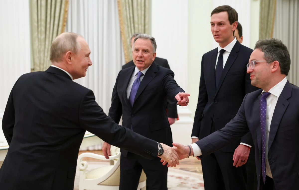 Russian President Vladimir Putin, left, greet U.S. President Donald Trump's envoys Steve Witkoff, centre left, Jared Kushner, second right, and Josh Gruenbaum, the head of the Federal Acquisition Service at the General Services Administration, at the Senate Palace of the Kremlin, in Moscow, Thursday, Jan. 22, 2026. (Alexander Kazakov/Sputnik, Kremlin Pool Photo via AP)