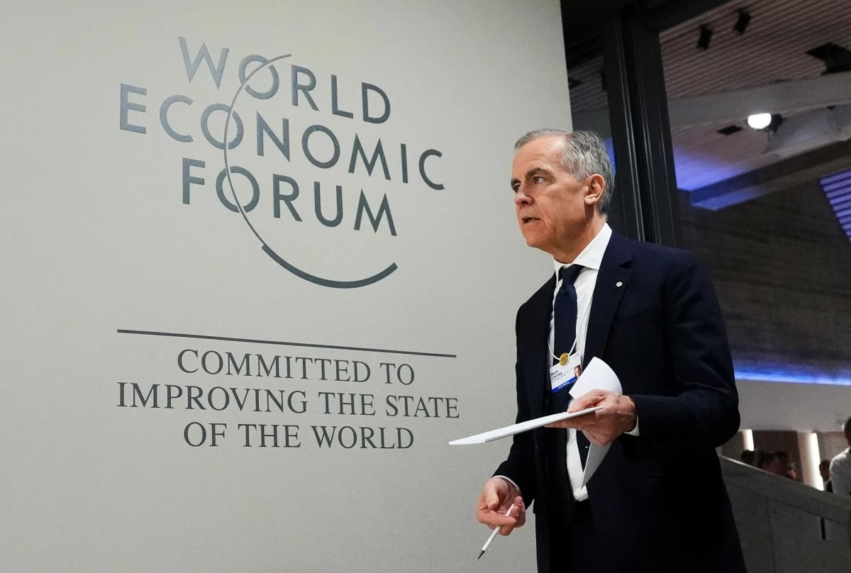 Canada Prime Minister Mark Carney makes his way to take part in an event tilted "Country Strategy Dialogue: Canada" as he attends the World Economic Forum in Davos, Switzerland on Tuesday, Jan. 20, 2026. (Sean Kilpatrick/The Canadian Press via AP)