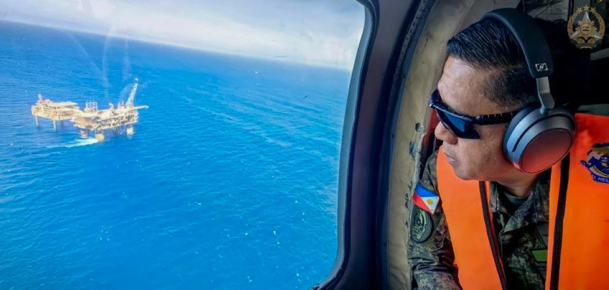 Armed Forces of the Philippines (AFP) Chief of Staff Gen. Romeo S. Brawner Jr. conducts an aerial inspection over the Malampaya natural gas field during his visit to Joint Task Force Malampaya in Palawan on January 23, 2026. (Photo: AFP)