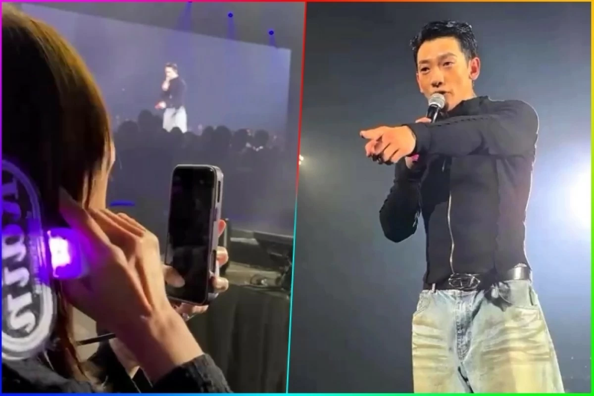 Korean singer Rain (right) points to the fan while the fan points to her ear at his concert in Taipei, Taiwan on Jan. 17 (Screenshots from Annsimmi's video)