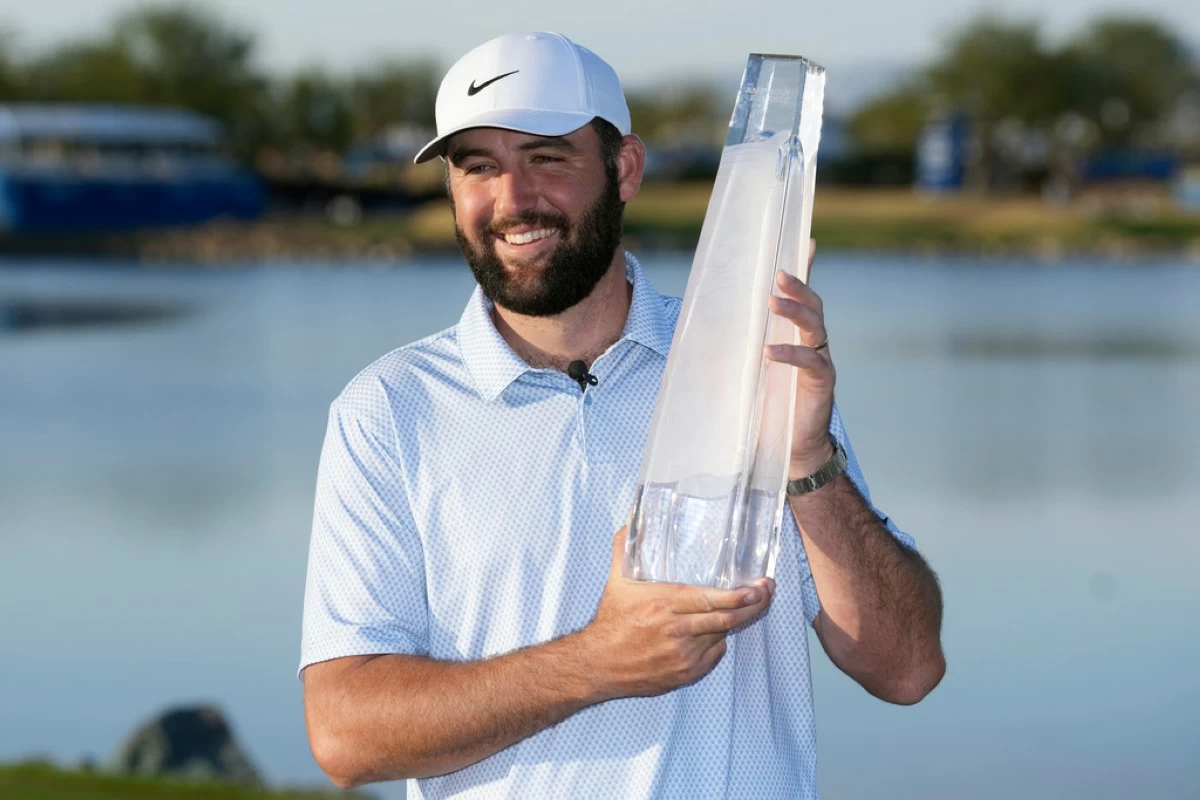 Scottie Scheffler smiles after winning the American Express golf event on the Pete Dye Stadium Course at PGA West Sunday, Jan. 25, 2026, in La Quinta, Calif. (AP Photo/Ross D. Franklin)