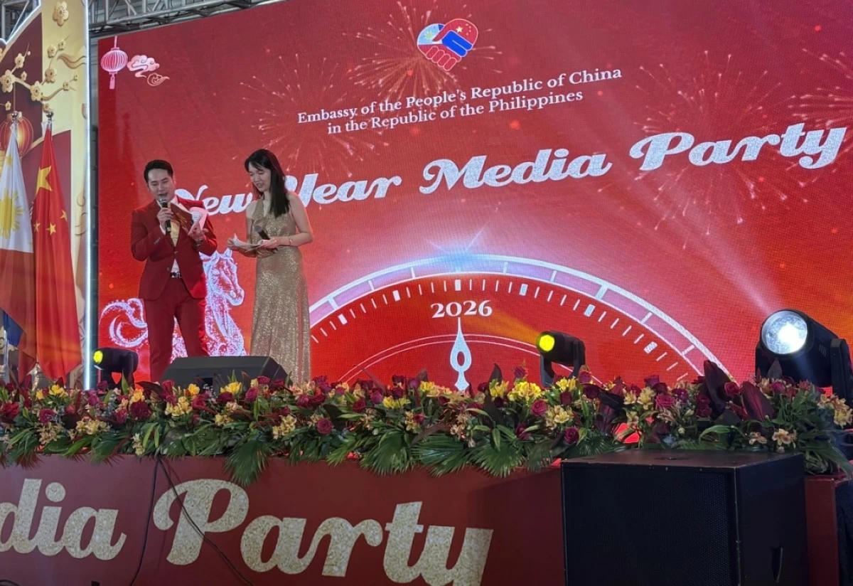 Louie and Louella share hosting duties at the Chinese Embassy New Year media party.
