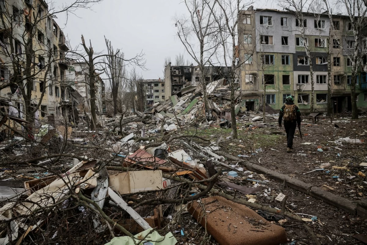 In this photo taken on Dec. 20, 2025 and provided by Ukraine's 24th Mechanized Brigade press service, a soldier walks through the ruins of the town of Kostyantynivka, in the Donetsk region, Ukraine. (Oleg Petrasiuk/Ukraine's 24th Mechanized Brigade via AP)