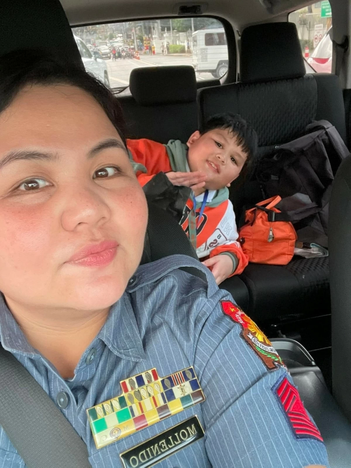 Police Senior Master Sergeant Diane Marie Mollenido and her son (Photo from L. Frances' Facebook account) 