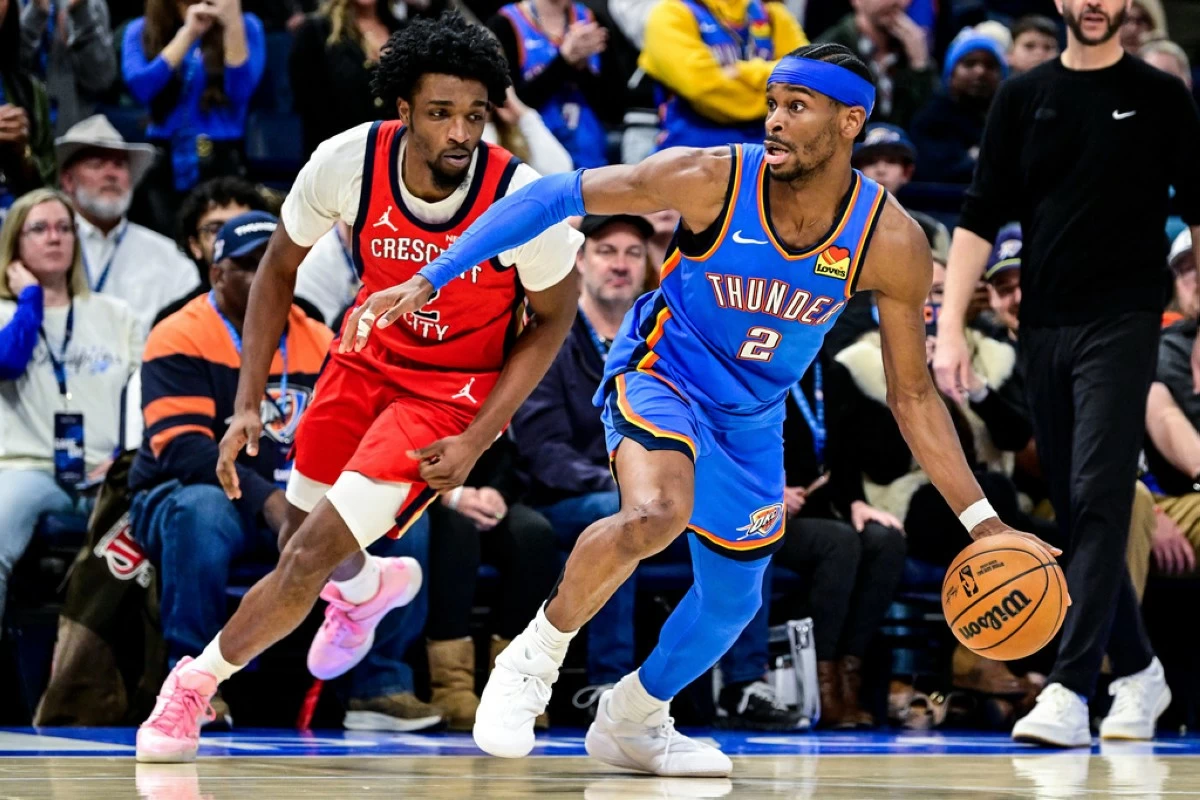 Oklahoma City Thunder guard Shai Gilgeous-Alexander (2) drives against New Orleans Pelicans forward Herbert Jones (2) during the second half of an NBA basketball game Tuesday, Jan. 27, 2026, in Oklahoma City. (AP Photo/Gerald Leong)