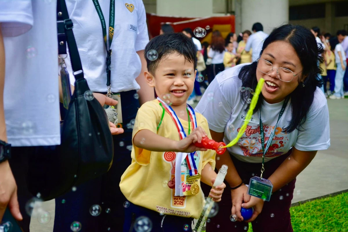A participant takes part in a Mini-Olympics activity at DLSU For the Kids 2025.