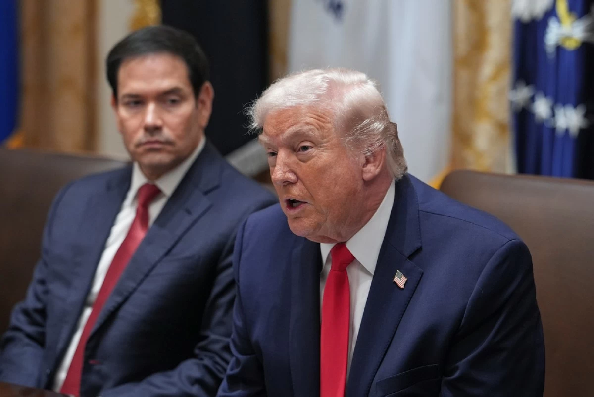 President Donald Trump speaks as Secretary of State Marco Rubio listens during a cabinet meeting at the White House, Thursday, Jan. 29, 2026, in Washington. (AP Photo/Evan Vucci)