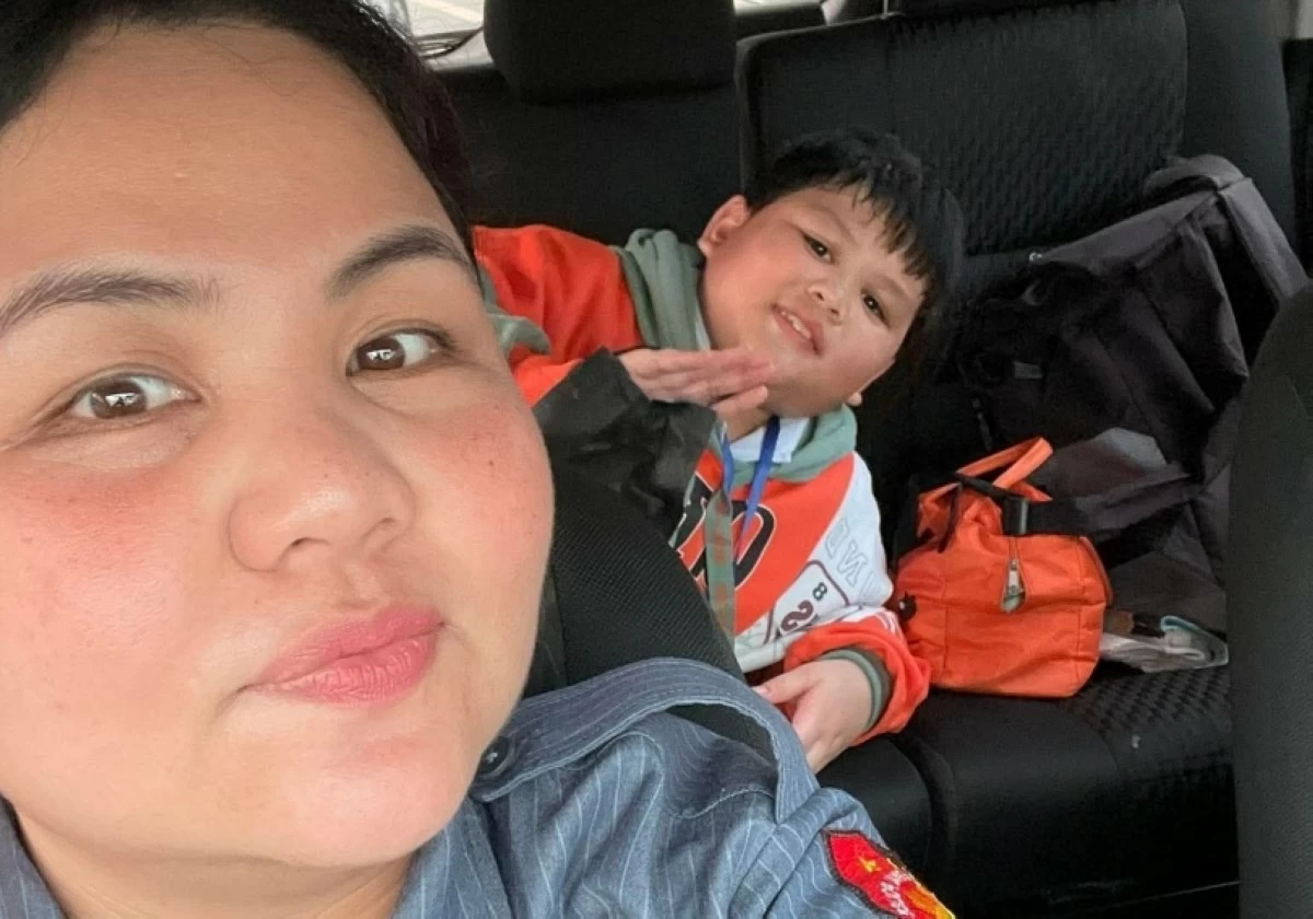 Police Senior Master Sergeant Diane Marie Mollenido and her son, John Ysmael (Photo from N. Ma on Facebook)
