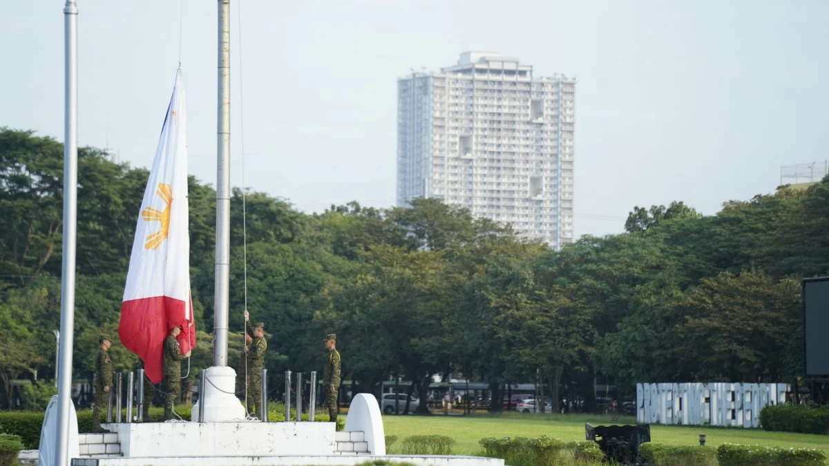 The Philippine flag is hoisted high as Armed Forces of the Philippines (AFP) personnel render honors, symbolizing national pride and unity, during a flag-raising ceremony at Camp Aguinaldo in Quezon City on December 1, 2025. (Photo: AFP)