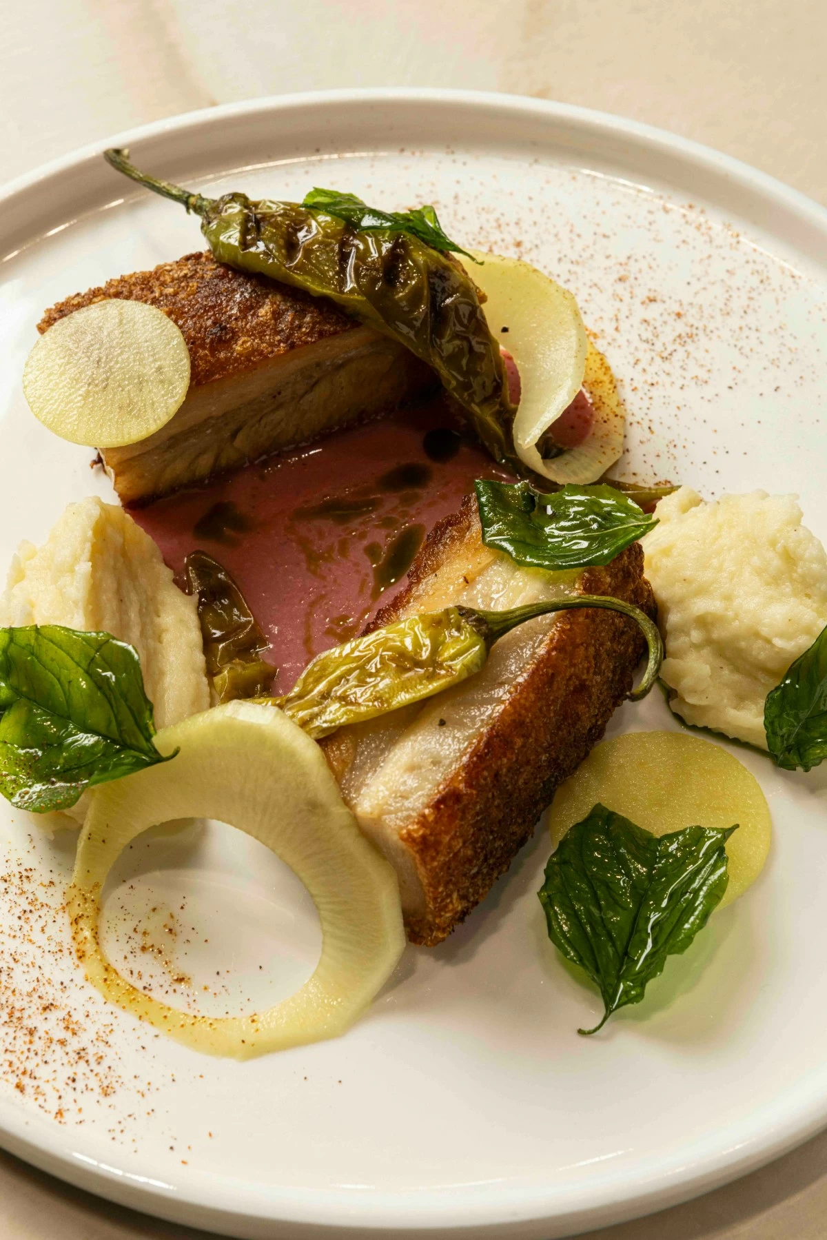 CRUNCH AND TANG Chicharrones paired with samaloc jus, a dish that reflects Half Saints’ instinct for familiar flavors nudged thoughtfully forward.