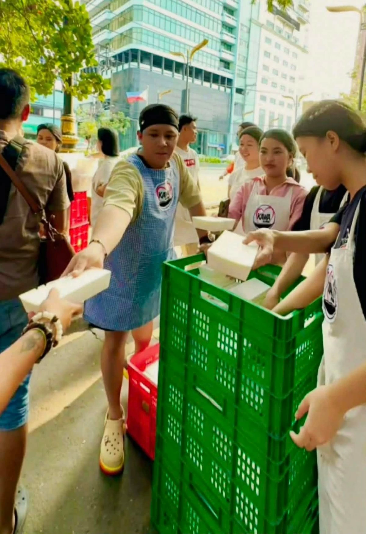 Chef Chris distributes food packs to the 