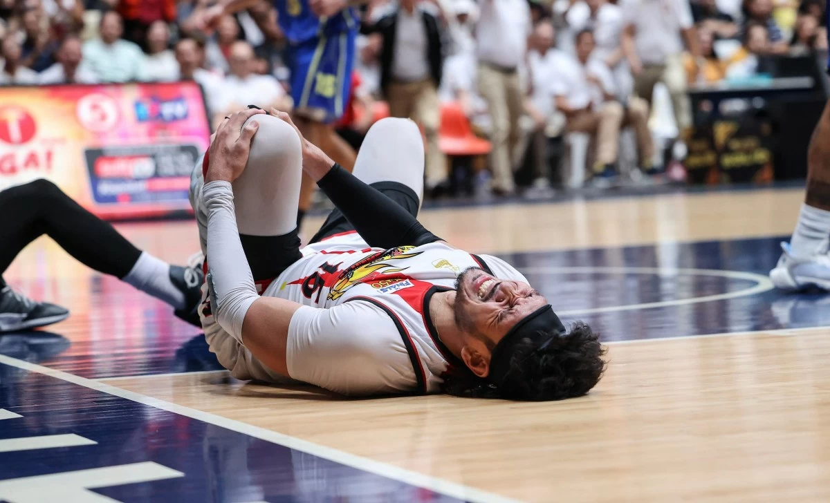 San Miguel's June Mar Fajardo grimaces in pain during Game 5 of their PBA Season 50 Philippine Cup finals against TNT. (PBA Images)