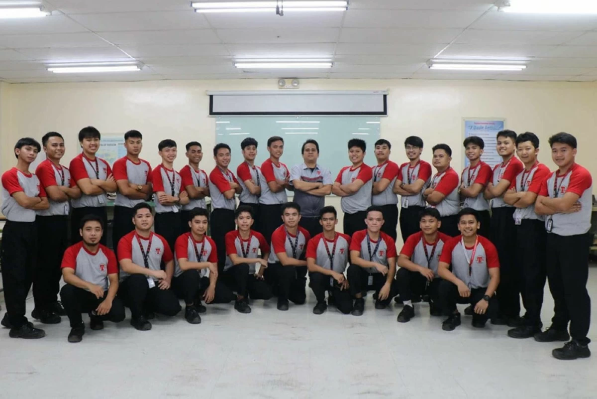 TMP Tech students, including Cruz, and their instructor.