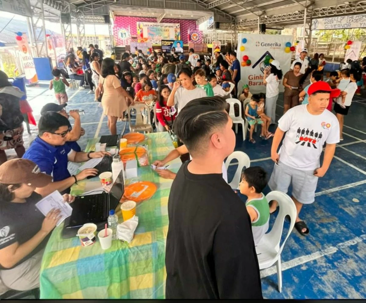 Residents of Libis, Binangonan including students and PWDs gather at the covered court of Libis Elementary School  to avail of the services offered in the medical mission and outreach program. (photo by the activity organizer)