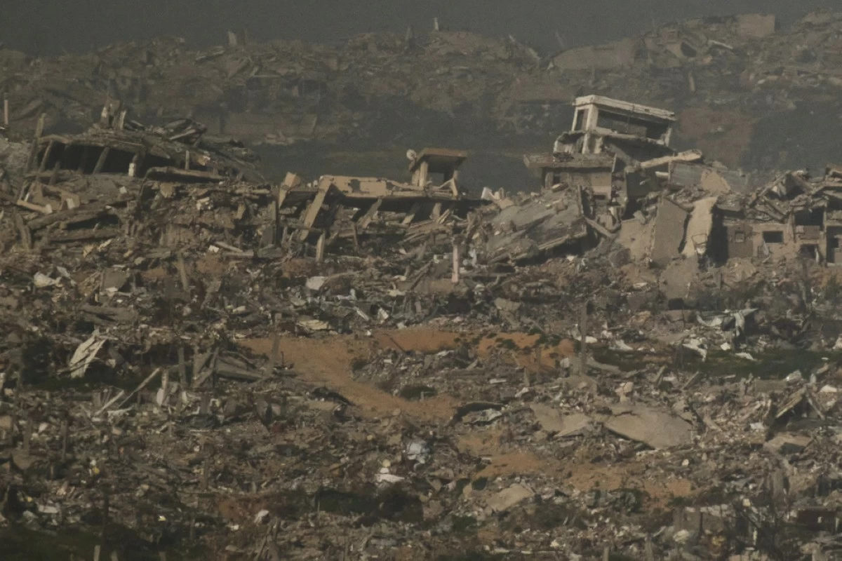 Buildings that were destroyed during the Israeli ground and air operations stand in the northern Gaza Strip as seen from southern Israel, Monday, Feb. 2, 2026. (AP Photo/Leo Correa)
