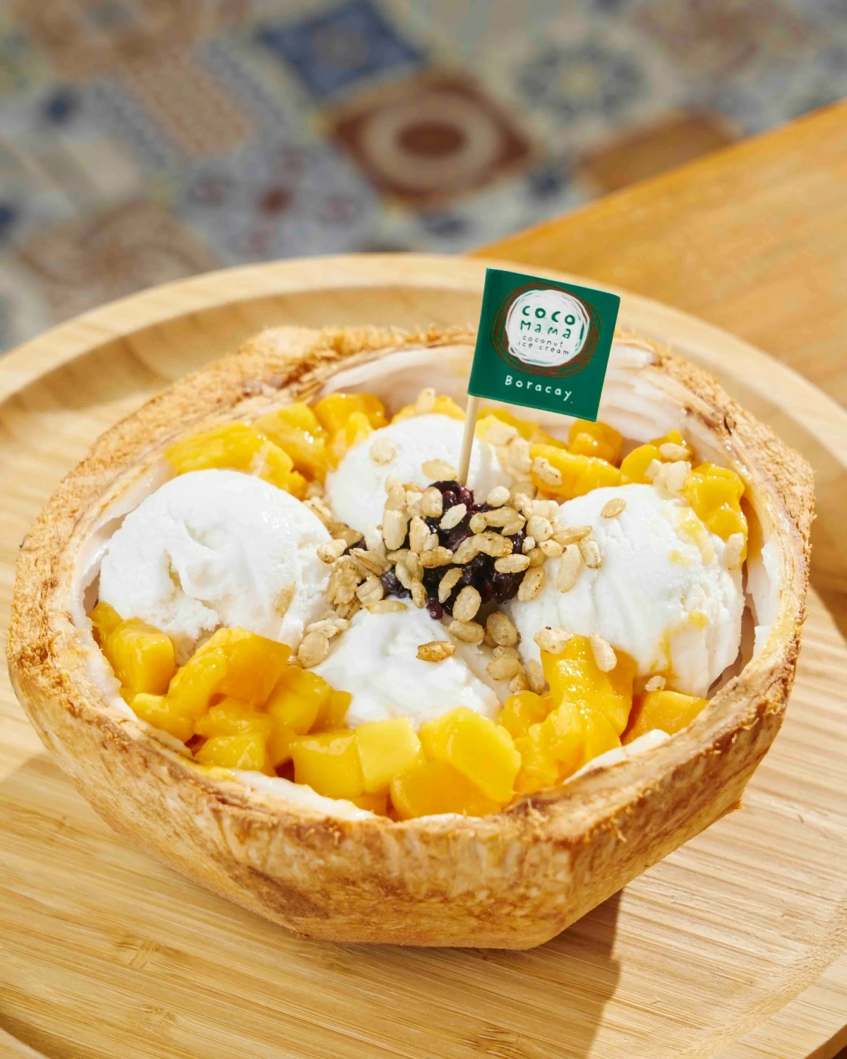 ISLAND SCOOP Coco Mama’s signature plant-based coconut dessert topped with fresh tropical fruit.