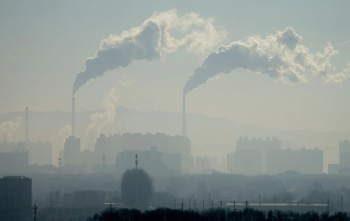 A power plant is seen from a train from Beijing to Shenyang in northwestern China on Jan. 3, 2026. (AP Photo/Ng Han Guan)