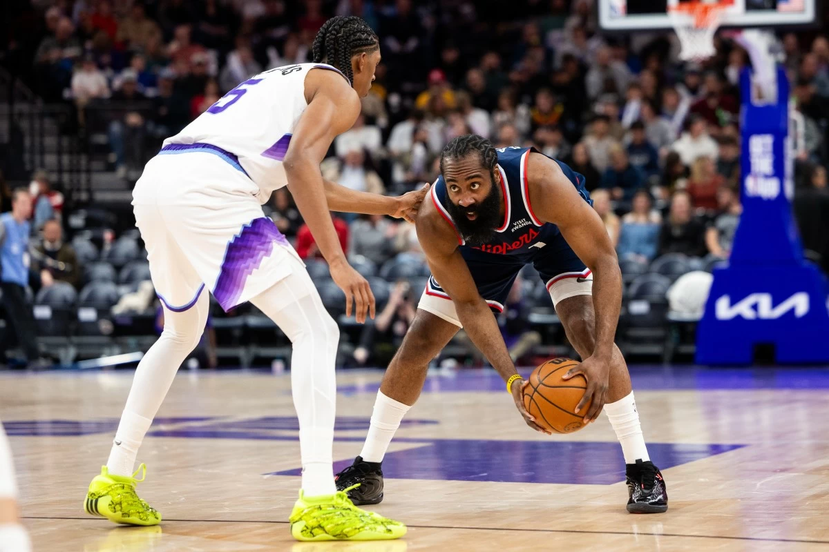 Utah Jazz forward Cody Williams, left, defends Los Angeles Clippers guard James Harden, right, during the second half of an NBA basketball game, Tuesday, Jan. 27, 2026, in Salt Lake City. (AP Photo/Anna Fuder)