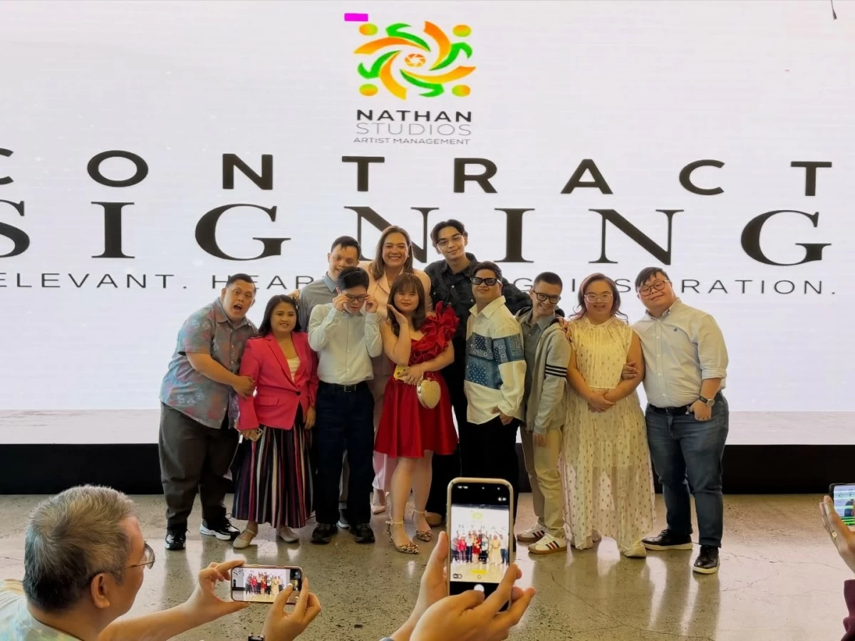 Sylvia Sanchez, of Nathan Studios; Ice, winner of 'Time to Dance,' and 'I'mPerfect' Down syndrome cast pose for a photo during a contract signing in Quezon City on Feb. 3. (Facebook)