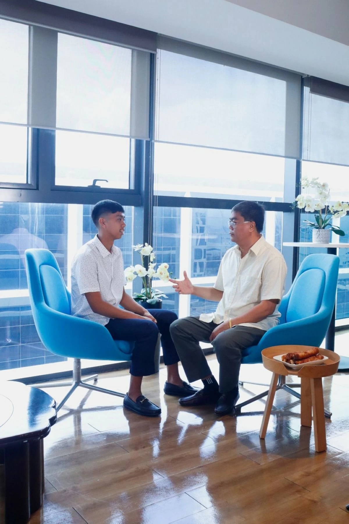 Reginal Del Rosario meets with his son, Jelo, who remains deeply involved and dedicated to the business, staying hands-on in sourcing and operations, including direct farm negotiations that help keep supply consistent across SM Markets stores.