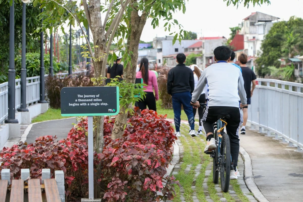 People jog and cycle at the Polo Riverwalk in Valenzuela City (Photo from Office of First District Rep. Kenneth Gatchalian)