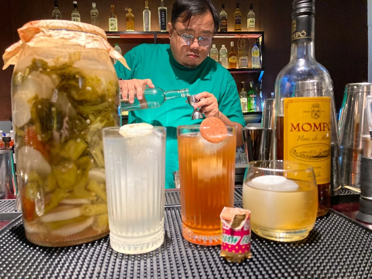 CHEERS Richie preparing cocktails for guests; From left Sinigang Highball, HawHaw Highball, and Padre Damaso