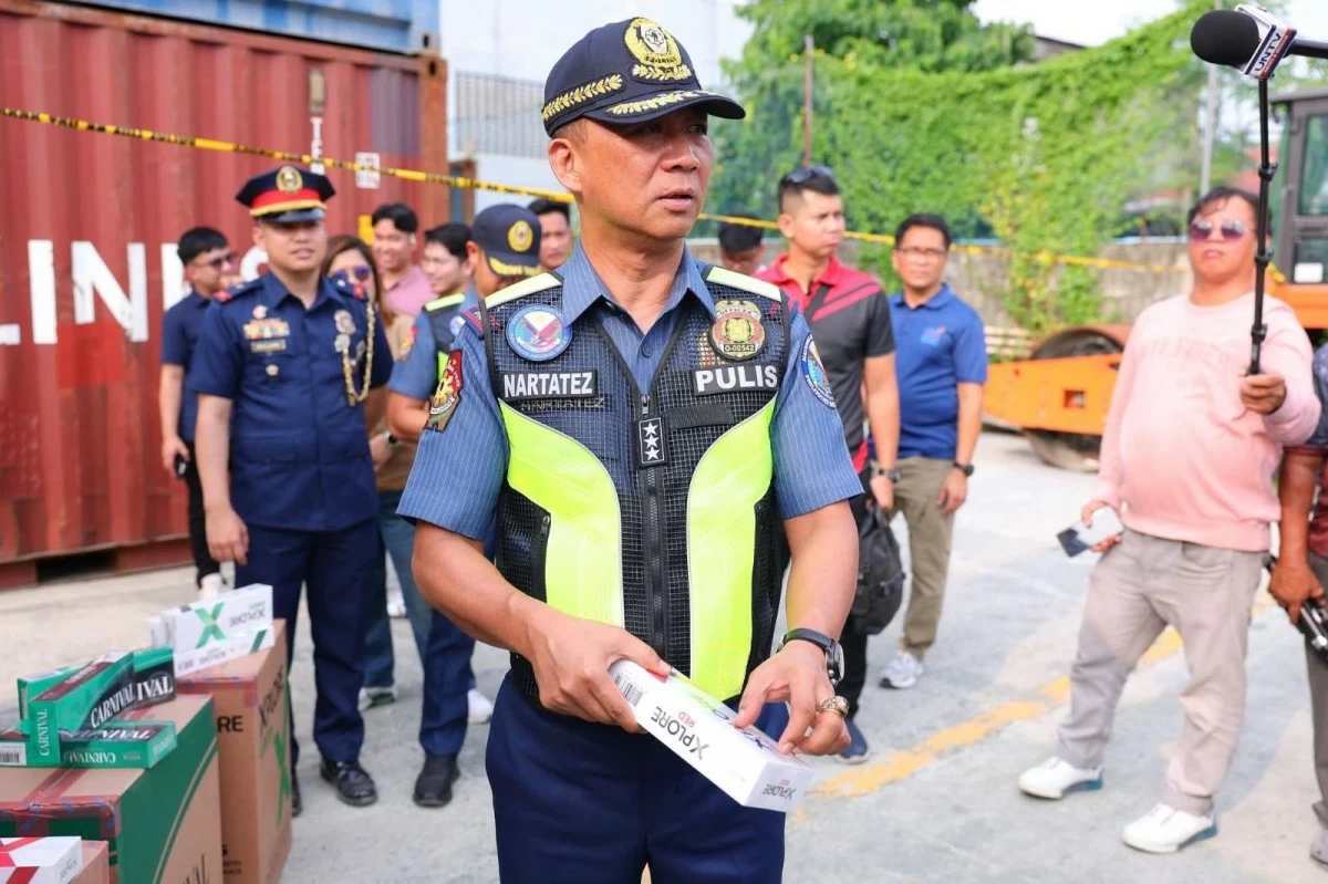 Acting PNP chief Lt. Gen. Jose Melencio Nartatez leads the inspection of abandoned container vans in Batangas City which later yielded around P1.1 billion worth of smuggled tobacco products. (photo: PNP) 