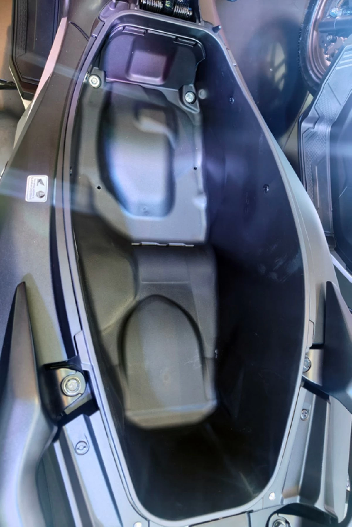 There's a spacious 30L luggage box under the seat