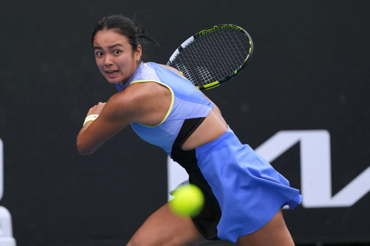 Alexandra Eala of the Philippines plays a backhand return to Alycia Parks of the U.S. during their first round match at the Australian Open tennis championship in Melbourne, Australia, Monday, Jan. 19, 2026. (AP Photo/Dar Yasin)