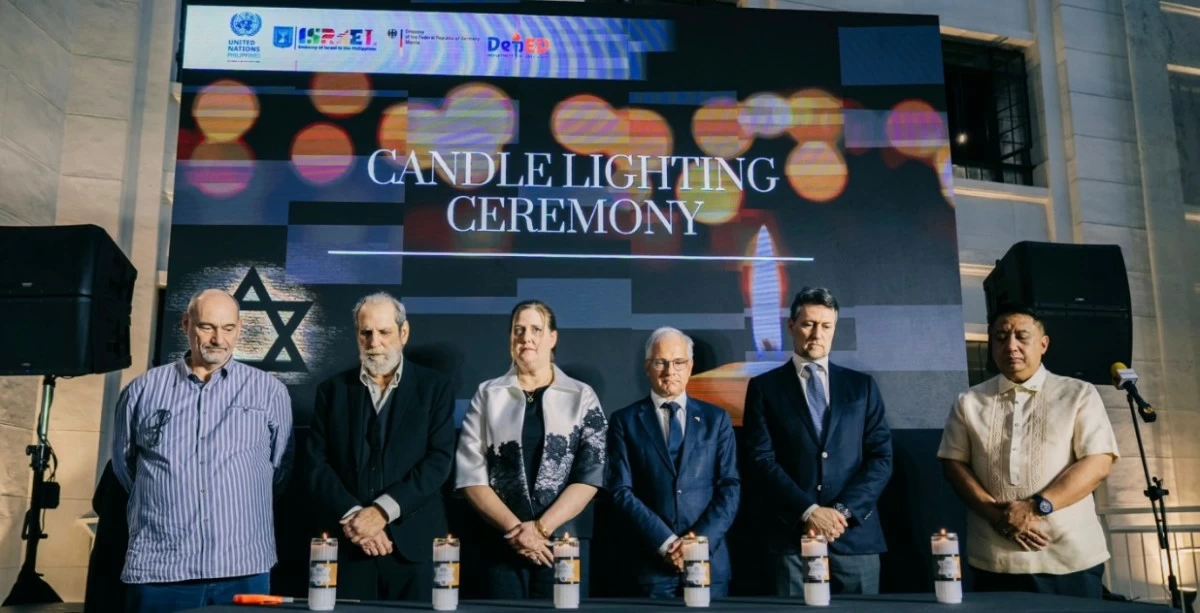 Quezon’s Game Director Matthew Rosen, President of the Jewish Association of the Philippines Salito Malca, Ambassador Dana Kursh of the Embassy of Israel, Ambassador Andreas Michael Pfaffersnoske of the Embassy of Germany, Mathias Kruse, Deputy Chief of Mission of Germany and Education Undersecretary Peter Irving Corvera light up six candles in memory of the six million Jewish men, women, and children who were murdered during the Holocaust.