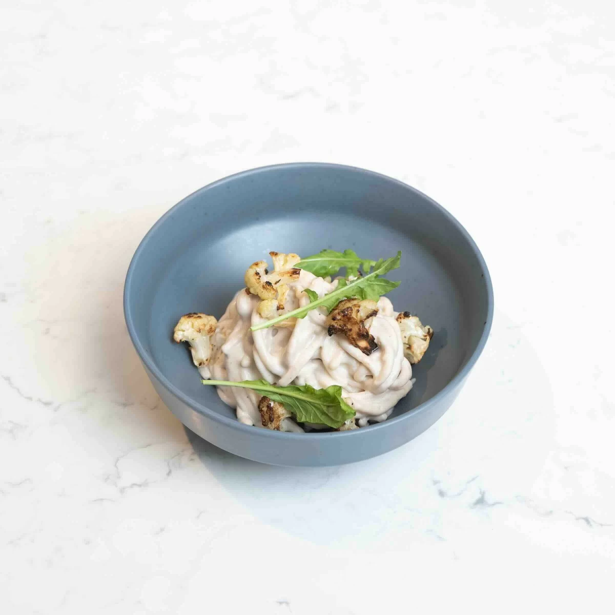 Almond Keto Spaghetti (cashew alfredo sauce, nutritional yeast, roasted cauliflower)