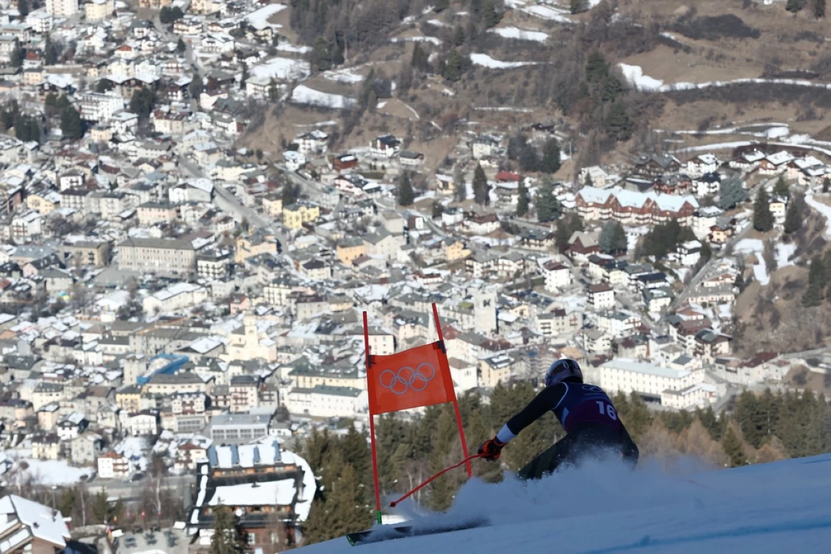 Finland's Elian Lehto speeds down the course of an alpine ski men's downhill portion of a team combined race, at the 2026 Winter Olympics, in Bormio, Italy, Monday, Feb. 9, 2026. (AP Photo/Gabriele Facciotti)